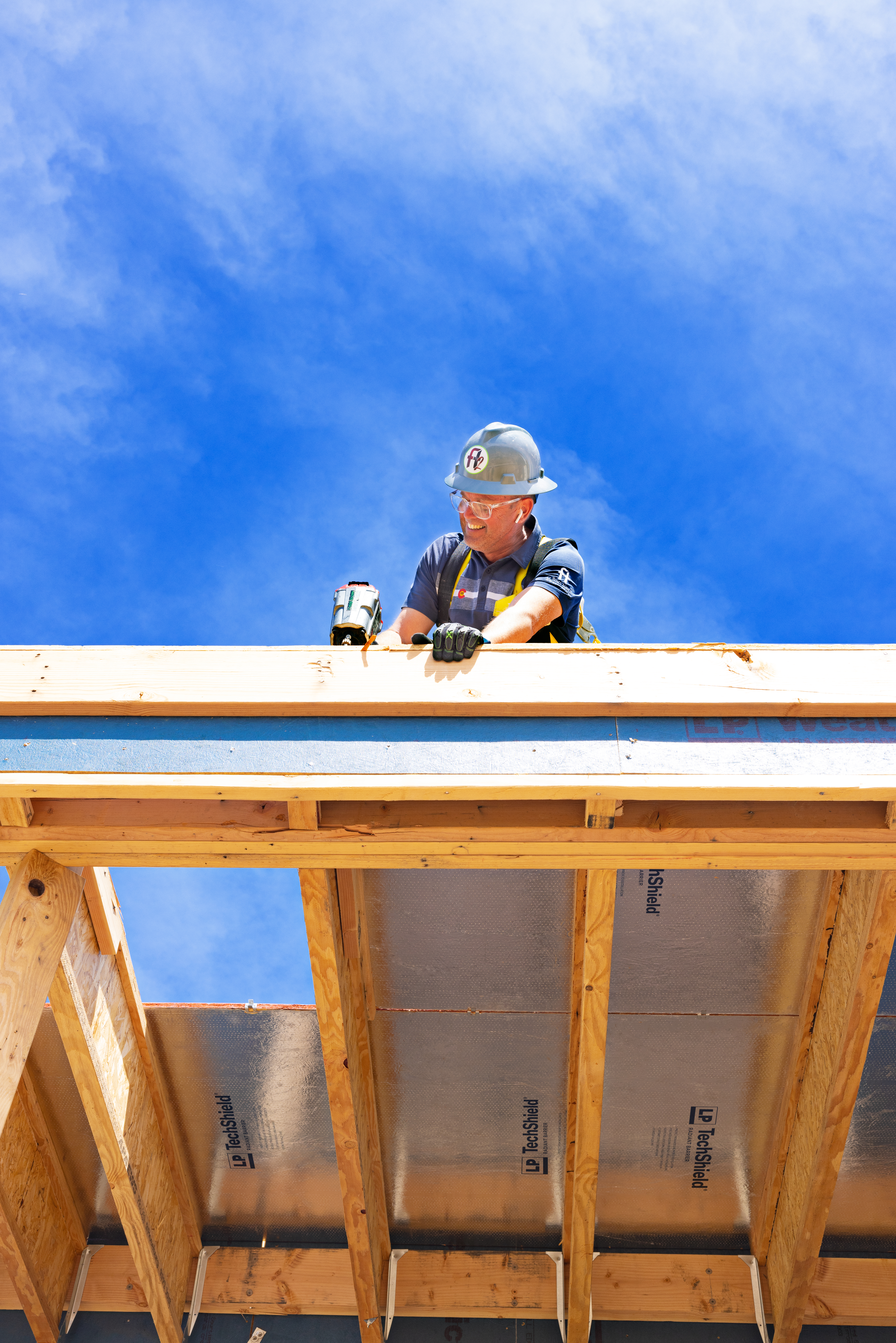 a construction worker installing LP TechShield panel